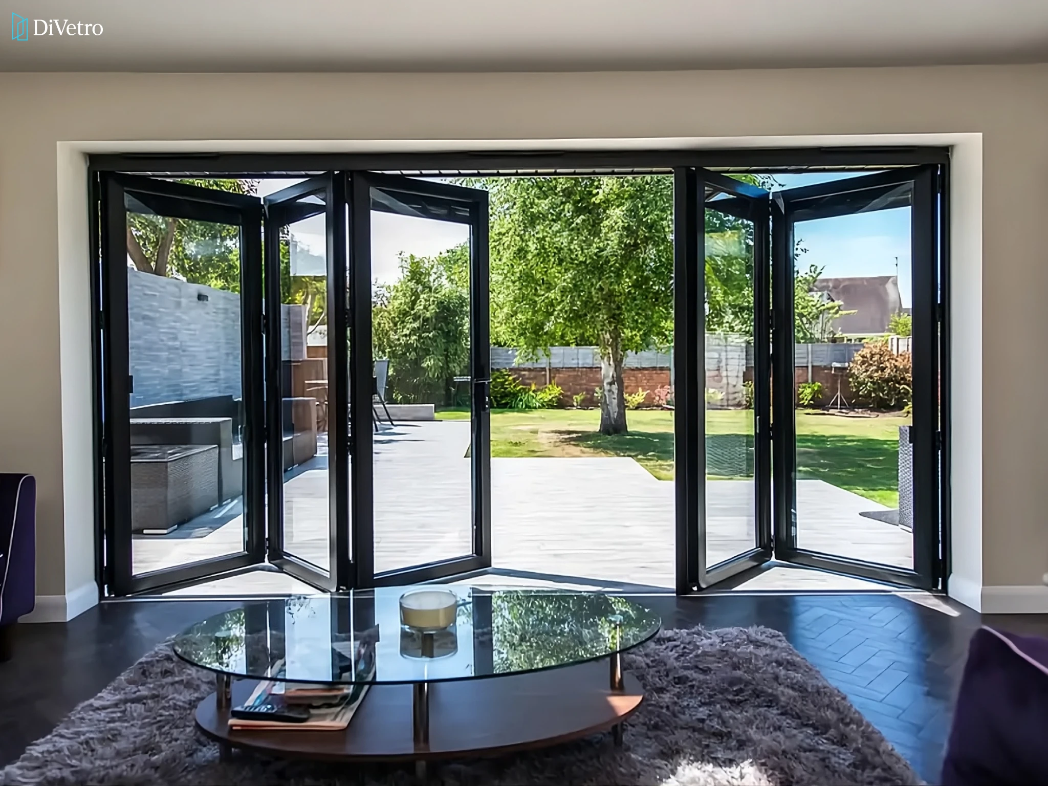 Aluminum bi-fold door system in matte black finish on a new build home — DiVetro