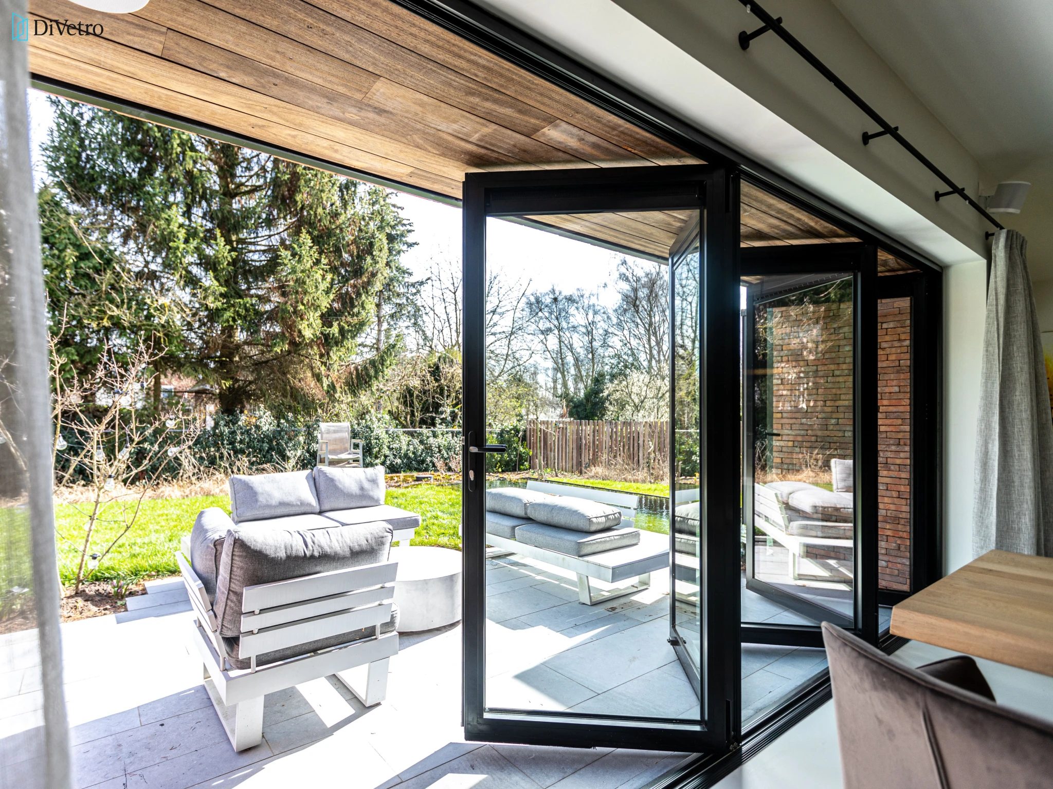 Aluminum bi-fold door with thermal break and triple glazing installed at a private home