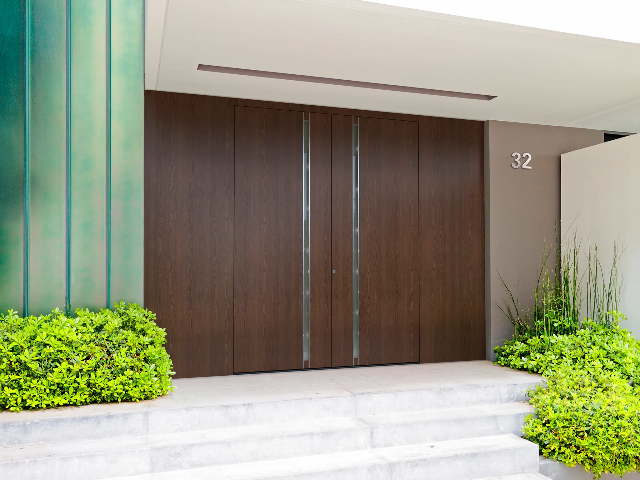 Pirnar Classico front door with stained glass and PVD accents — real installation