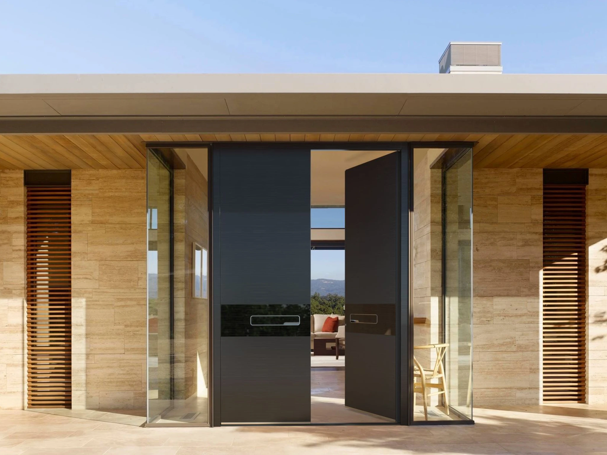 European aluminum front door with transom window on a modern home entrance