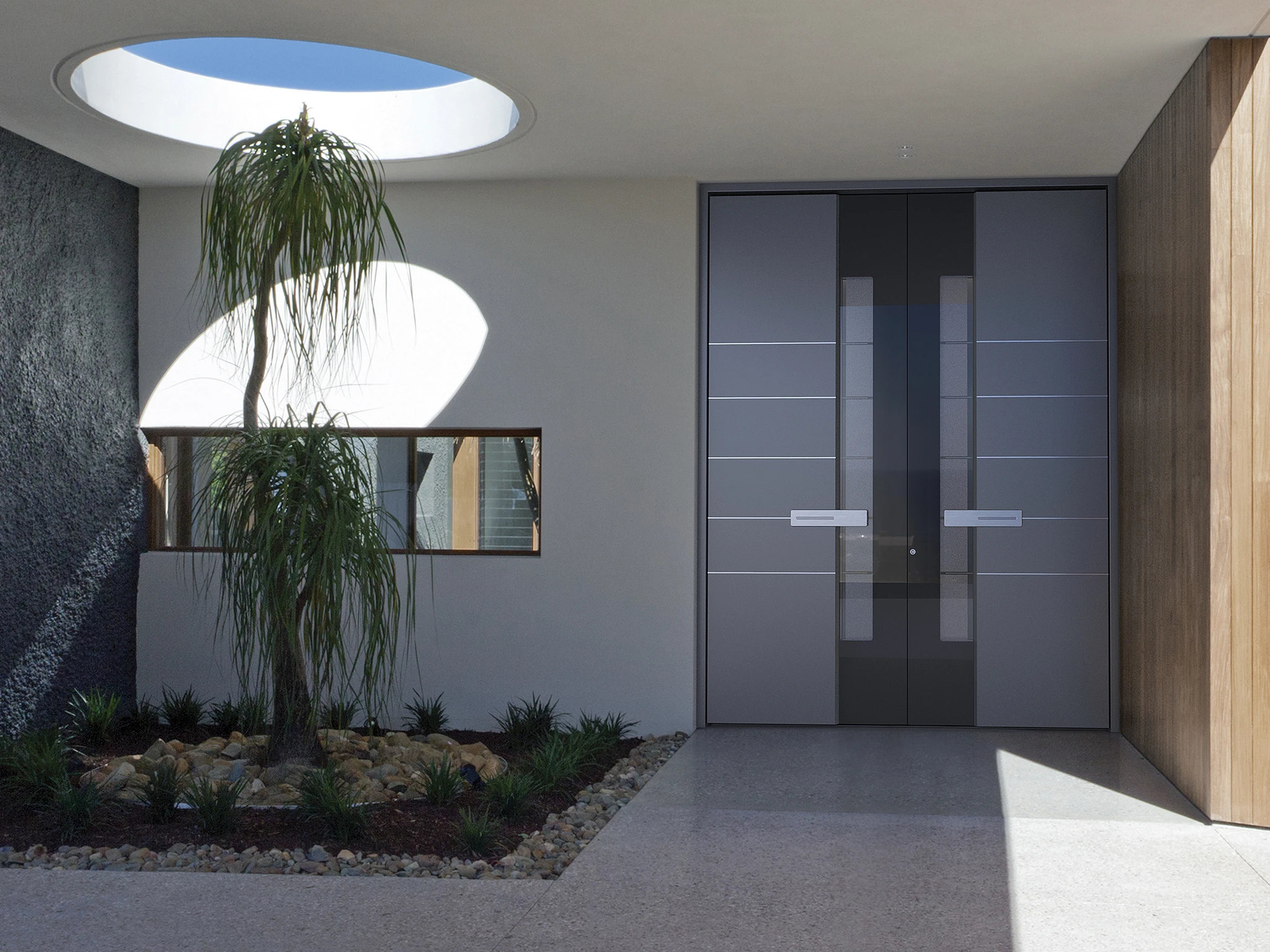 Pirnar entry door with decorative tempered glass panel on a modern home