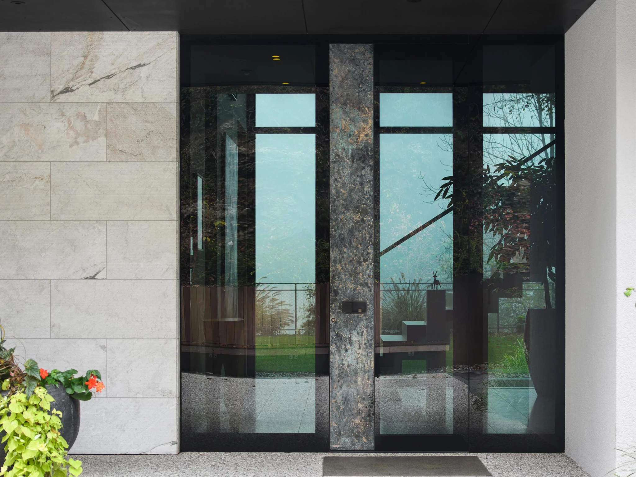 Pirnar aluminum front door installed at a modern home entrance — real project