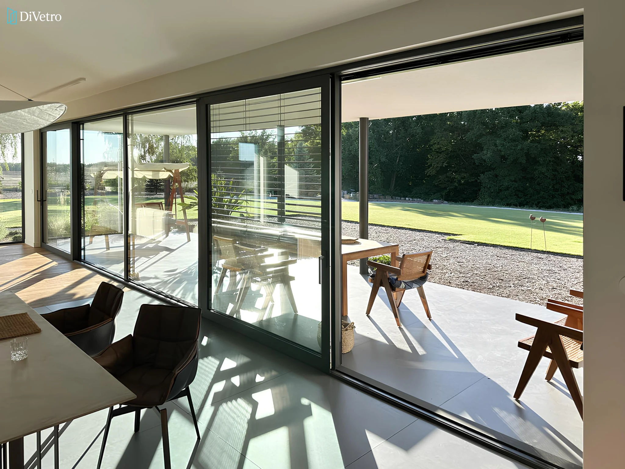 Large sliding door connecting indoor living room to outdoor terrace — real installation